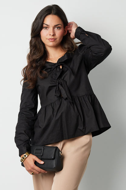 Longsleeve peplum top met strikjes
